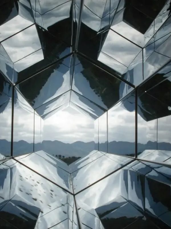 A futuristic glass building with reflections