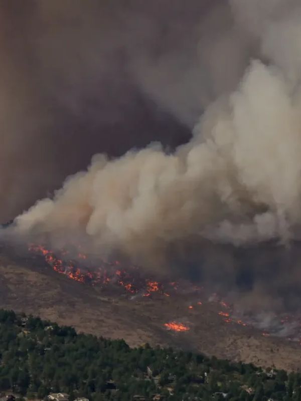 Wildfires rage over a mountainside 